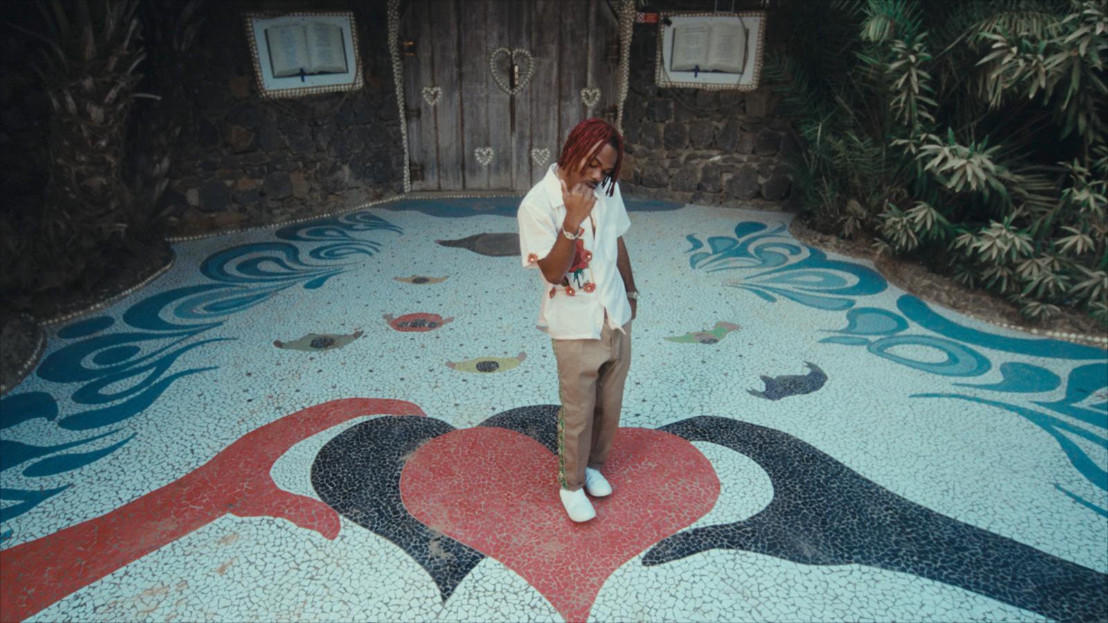 a woman standing in front of a painted floor