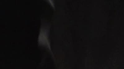 a blurry photo of a person in the dark