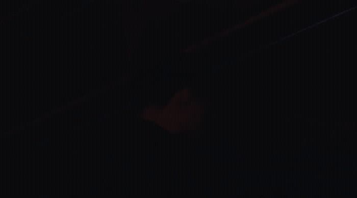a blurry photo of a person in the dark