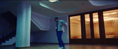 a man riding a skateboard down a hallway