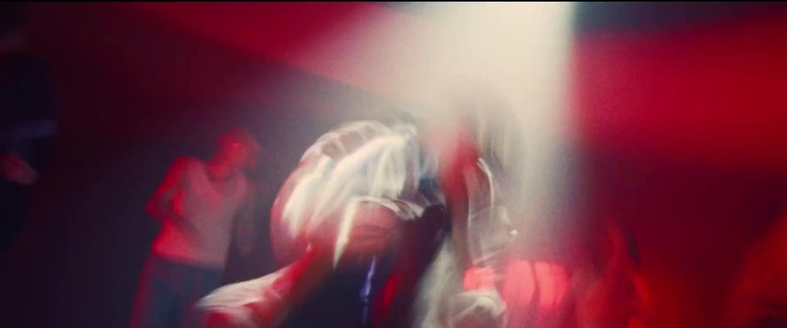 a blurry photo of a person on a stage