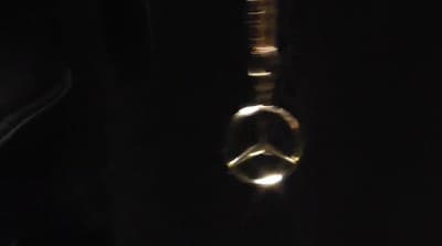a close up of a metal object in the dark