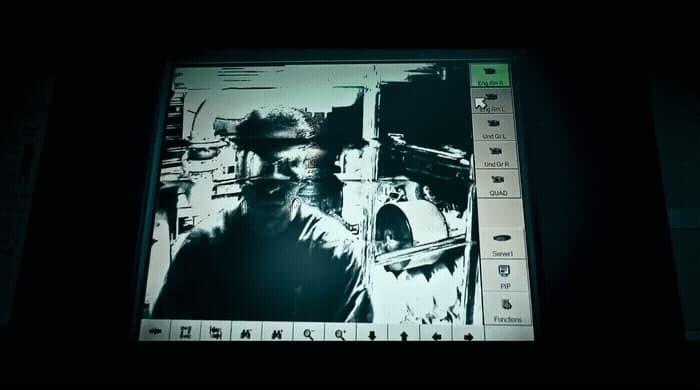 a computer screen with a picture of a man holding a gun