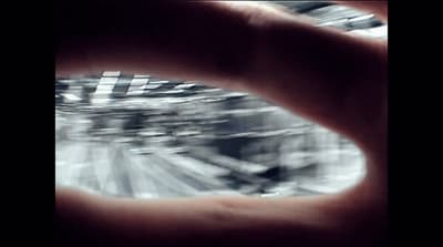 a blurry photo of a person's hand holding something
