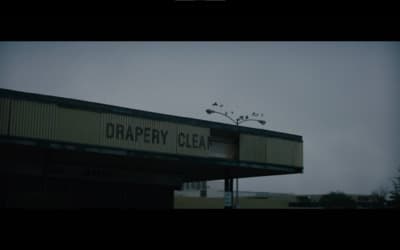 a sign on top of a building that says draper clear