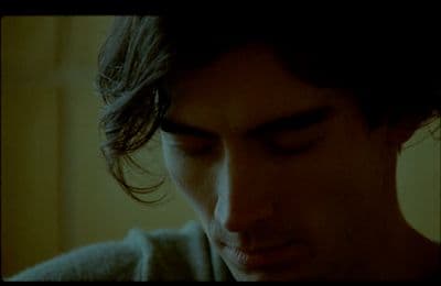 a close up of a person with his eyes closed