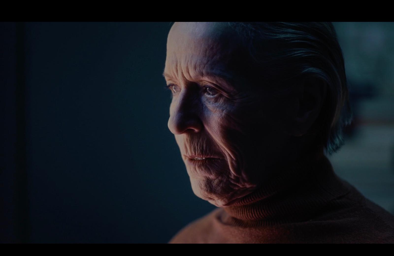 an older man with a serious look on his face