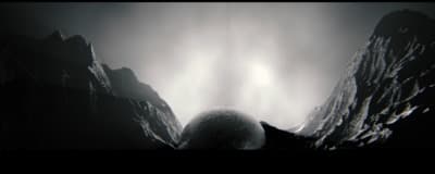 a black and white photo of a mountain range