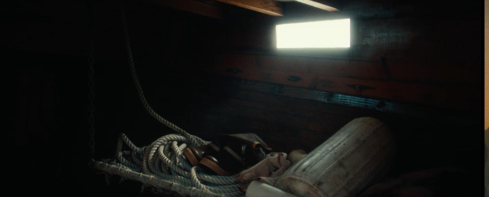 a rope in a room with a window