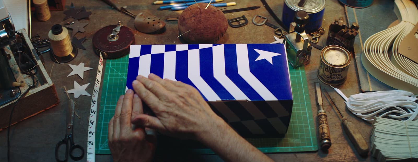 a person working on a blue and white box