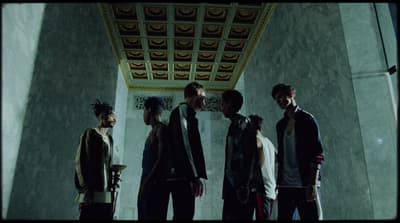 a group of young men standing next to each other