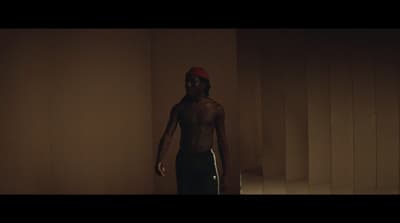 a man standing in a dimly lit room