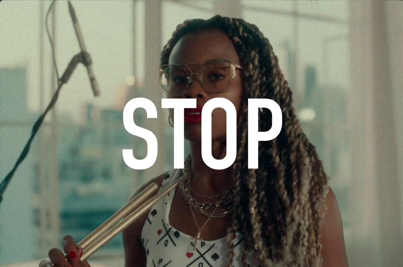 a woman with dreadlocks holding a microphone