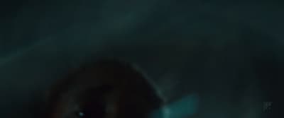 a blurry photo of a person's face in the dark