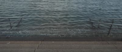 a couple of steps that are in the water