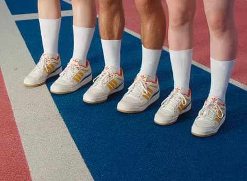 a group of people standing next to each other on a court