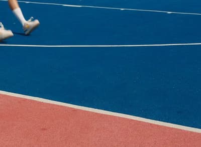 a person with a tennis racquet on a court