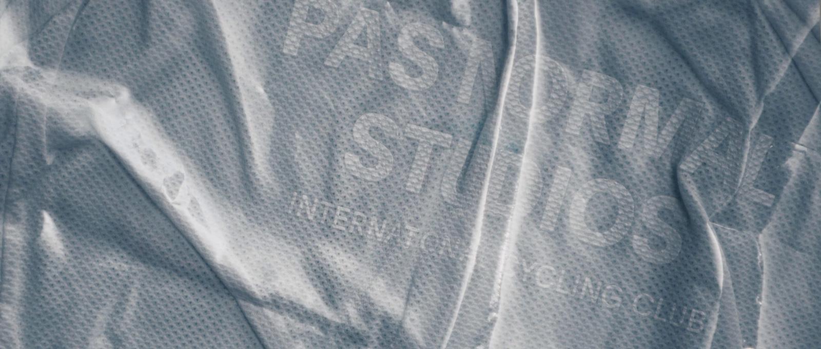 a close up of a white shirt with a logo on it