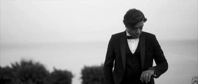 a man in a tuxedo and bow tie
