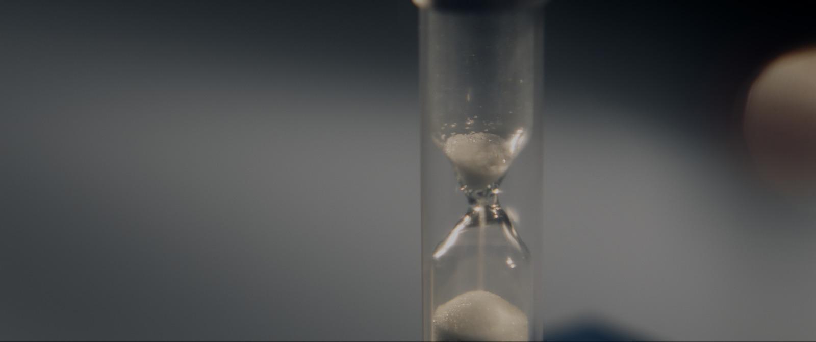 an hourglass with sand inside of it
