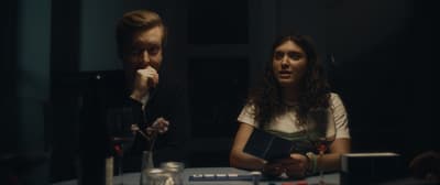 a man and a woman sitting at a table