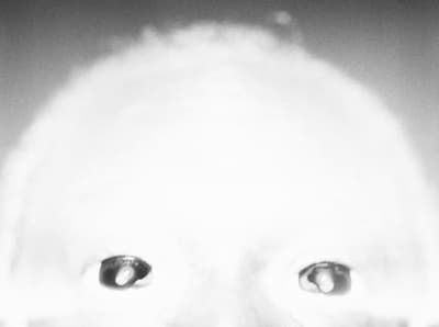 a black and white photo of a person's face