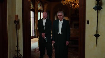a couple of men standing next to each other
