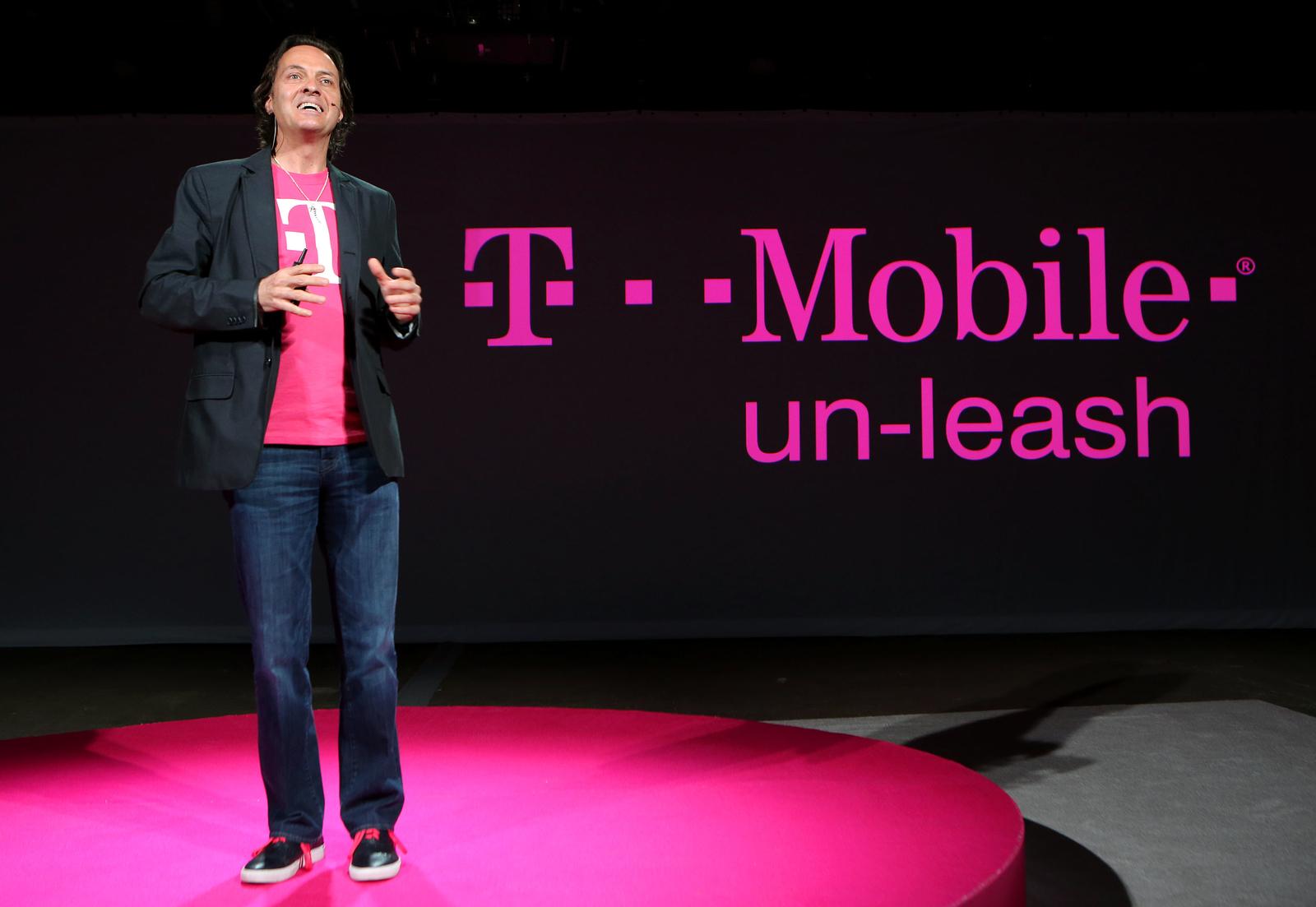 a person standing on a stage with a microphone
