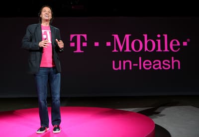 a person standing on a stage with a microphone