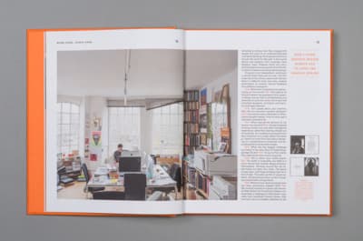 a book opened to a page showing a man working in a home office