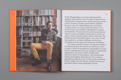 a man sitting in a chair in front of a bookshelf