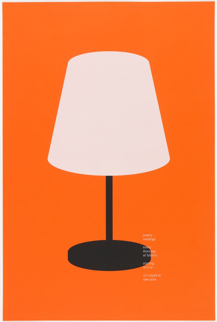 a white lamp sitting on top of a table