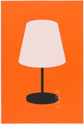 a white lamp sitting on top of a table
