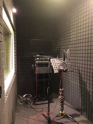a recording studio with microphones and lights