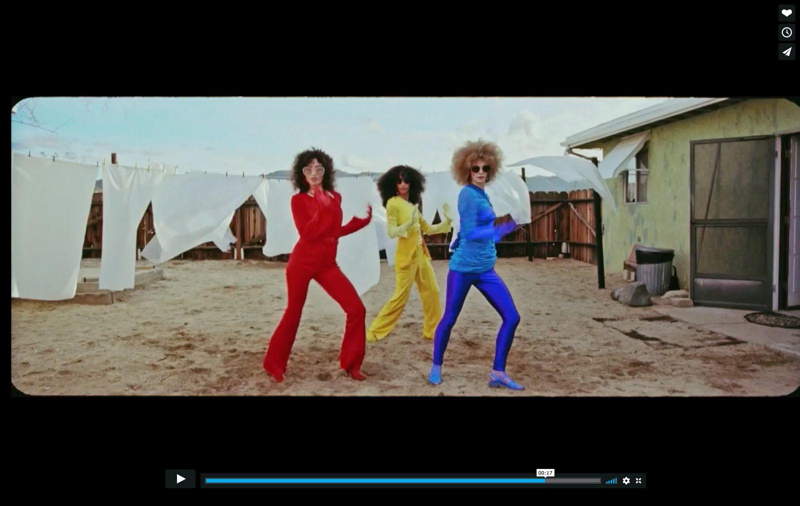 a screen shot of a group of women dancing