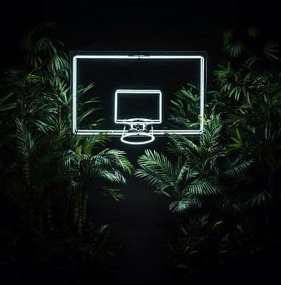 a basketball hoop lit up in the dark