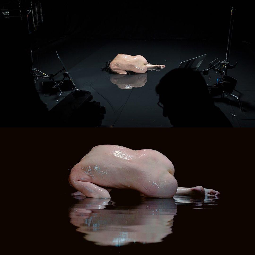 a chicken laying on top of a black table