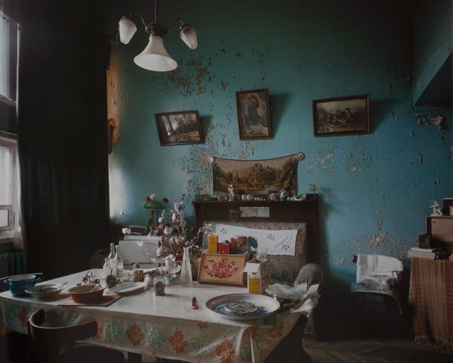a dining room with a table and chairs