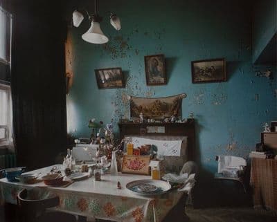a dining room with a table and chairs