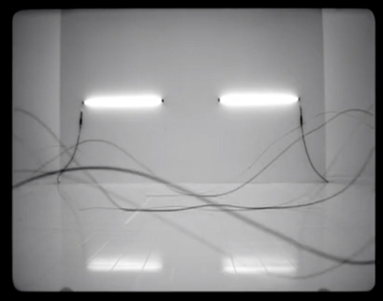 a black and white photo of some wires in a room