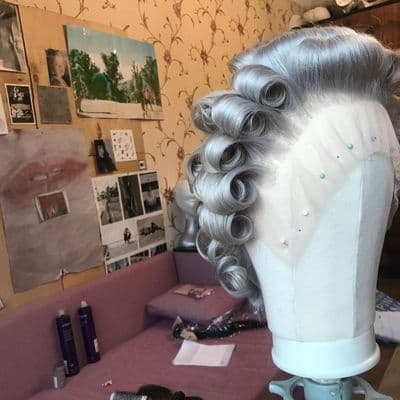 a wig is sitting on a table in a room