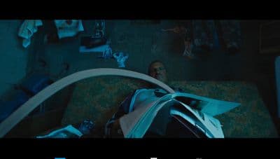 a man laying on top of a bed in a room