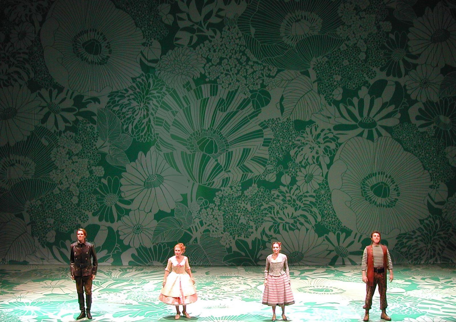 a group of people standing on top of a stage