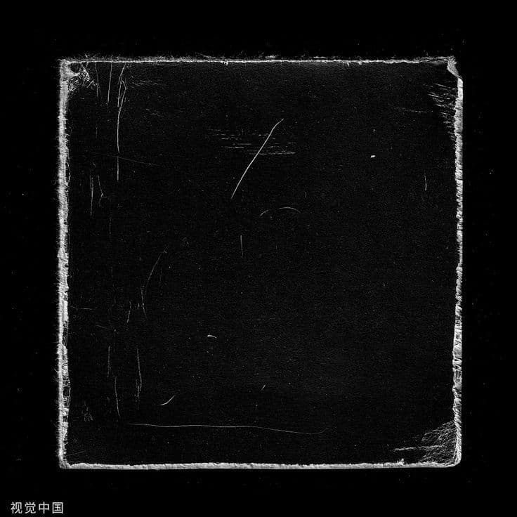 a black and white photo of a square