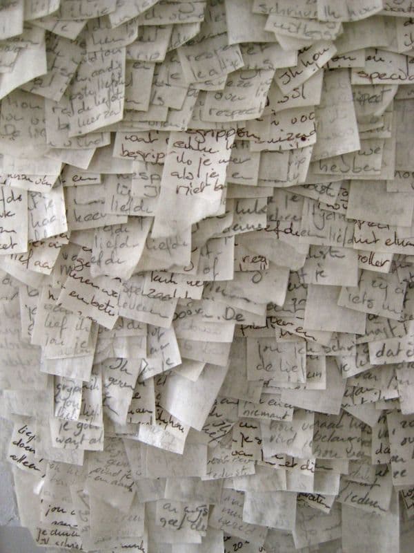 a bunch of papers with writing on them