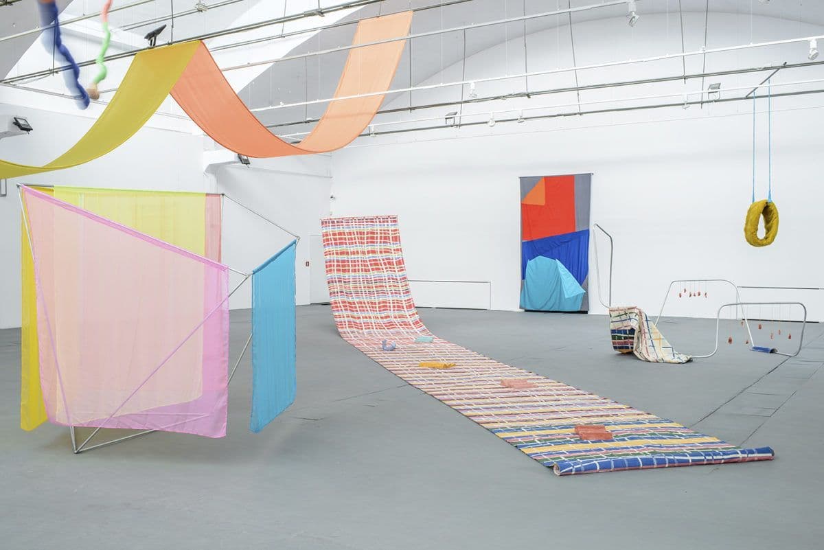 a large room with a long rug on the floor