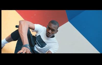 a man in a white shirt and black pants
