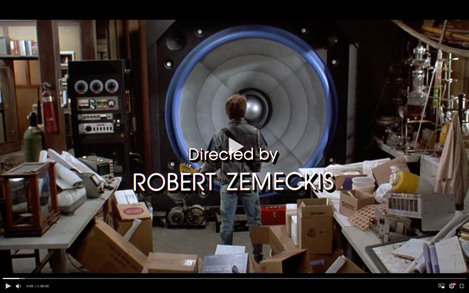 a man standing in a room filled with boxes