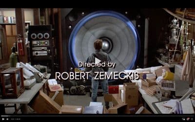 a man standing in a room filled with boxes