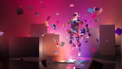 a person standing on a stage with a lot of confetti in the air